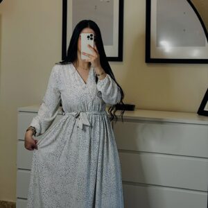 Elegant white polka dot dress with a belt